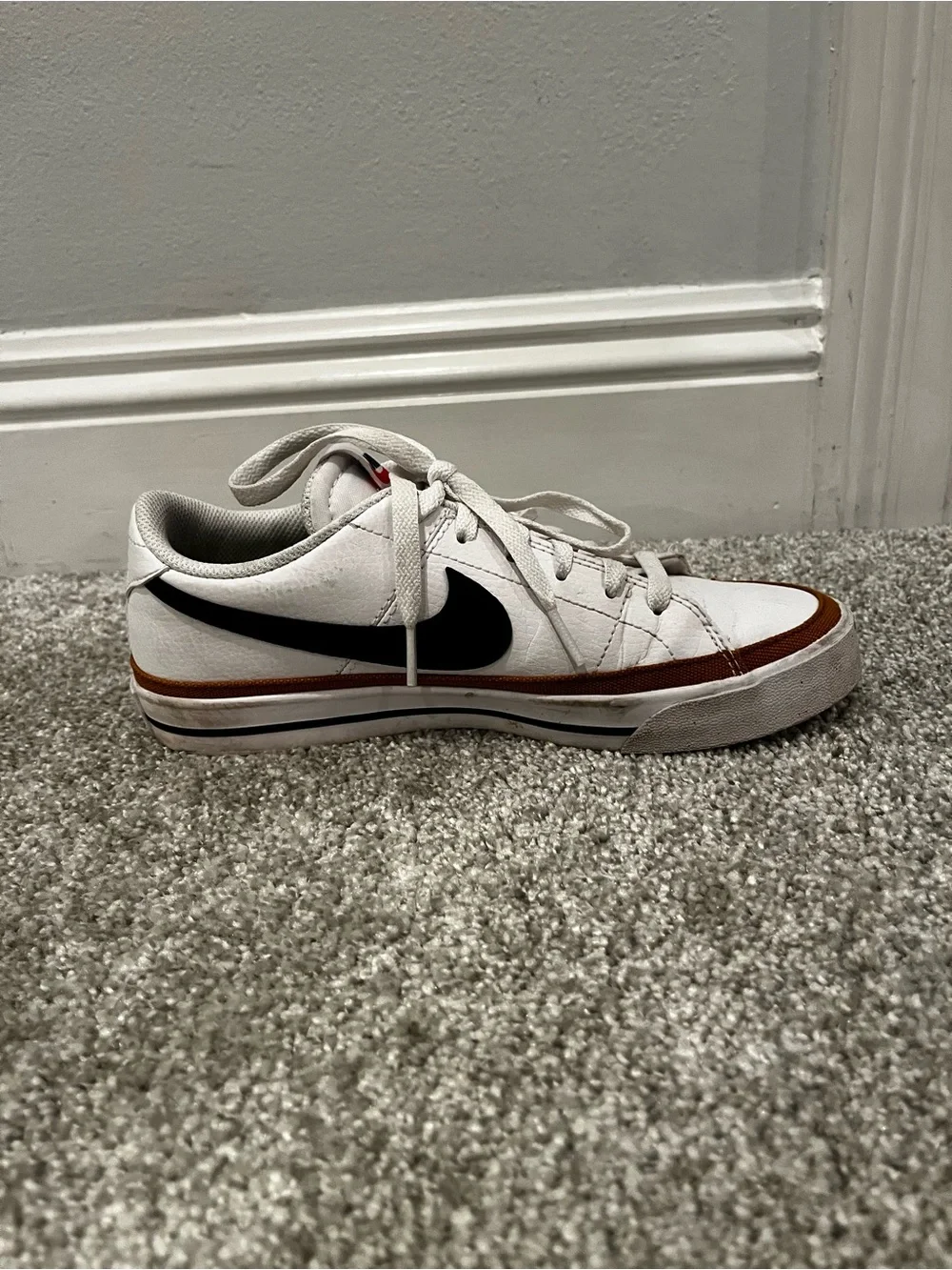 Nike women’s White Sneakers with Black Swoosh and Brown Trim